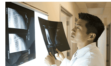 Dr. Trong B. Nguyen viewing an x-ray